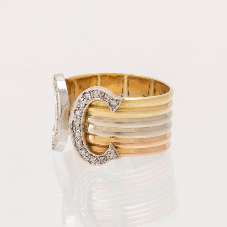 A Cartier "Double C" ring 18K tricolor gold set with round single-cut diamonds.