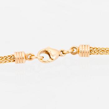 KAULAKORU, "Aurinkoleijona", 18K kultaa. Kalevala Koru 1998.