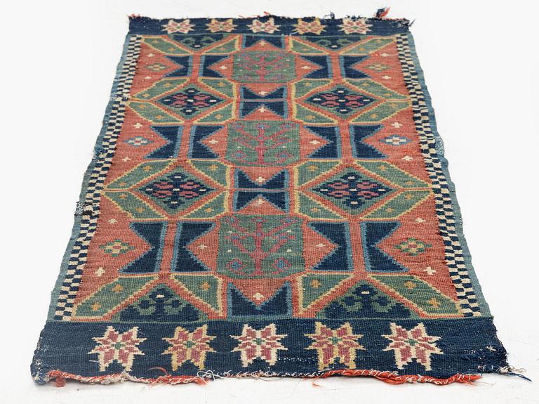 A carriage cushion, double-interlocked tapestry, c. 102 x 48 cm, Scania, Sweden, last quarter of the 18th century.