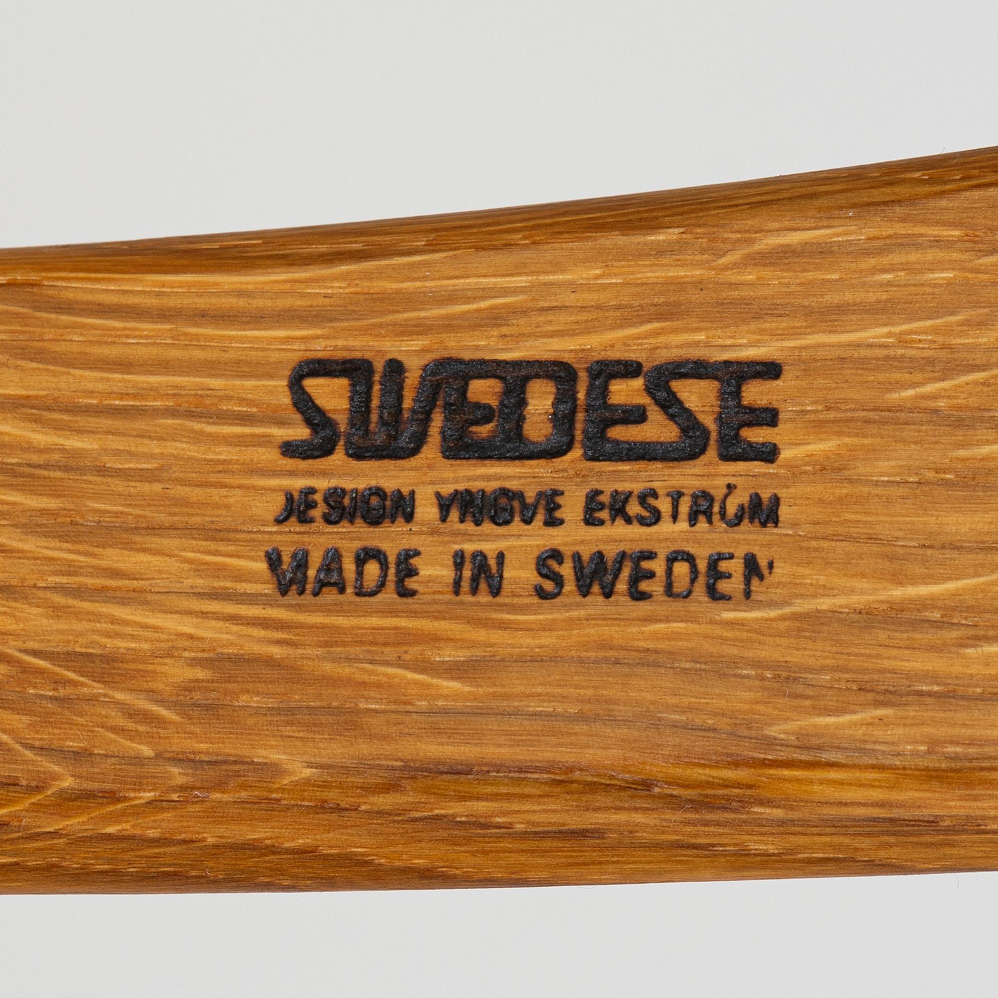 Yngve Ekström, A pair of armchairs, a footstool, “Lamino”, and a side table, Swedese, 2000s.