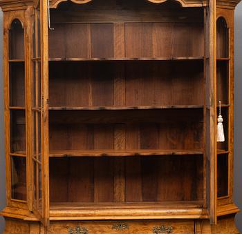 A Rococo style display cabinet, the Netherlands, circa 1900.