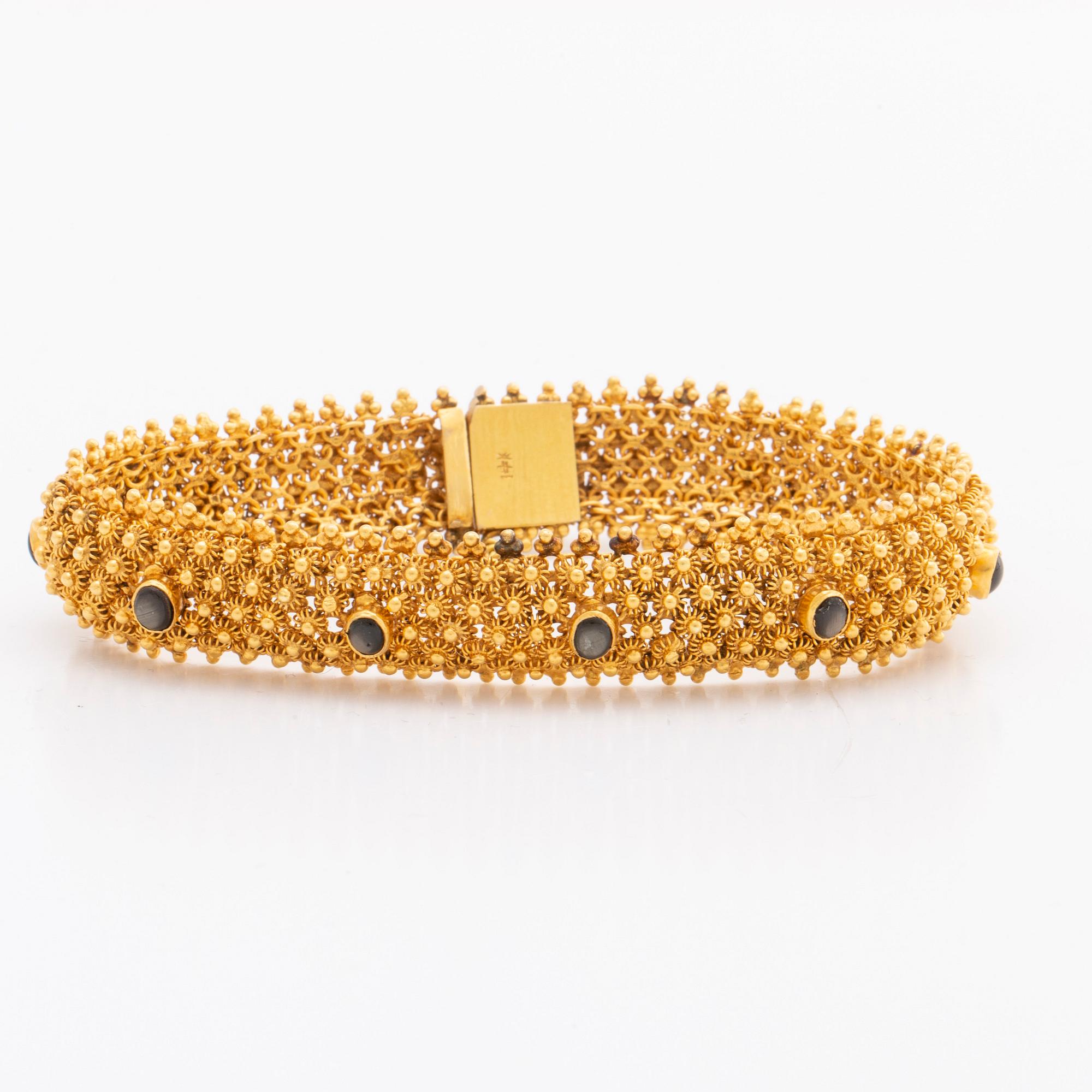 ARMBAND 14K guld, 35,1 g. bruna cabochonslipade stenar, ca 19 x 1,5 cm.