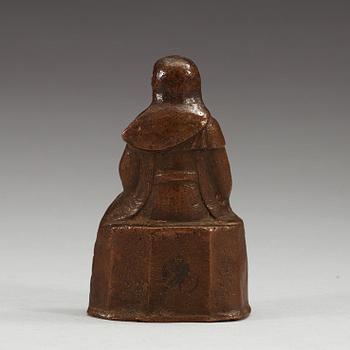 A seated copper-alloy figure of a the God of War, Guan Di, Ming dynasty (1368-1644).