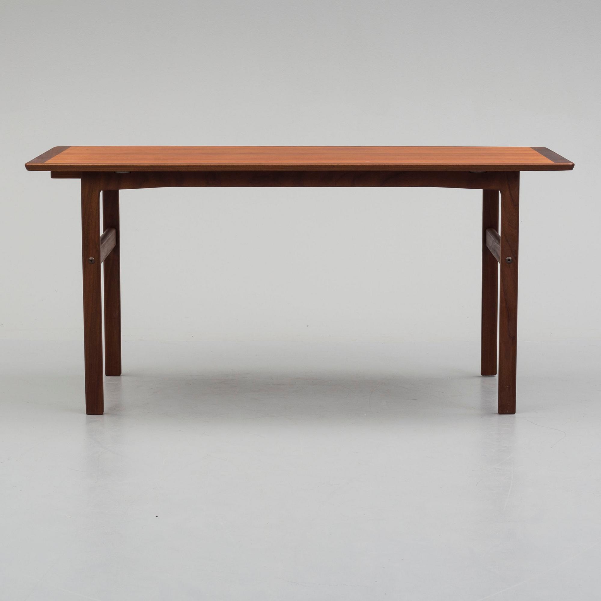 A second half of the 20th century teak vaneered coffee table.