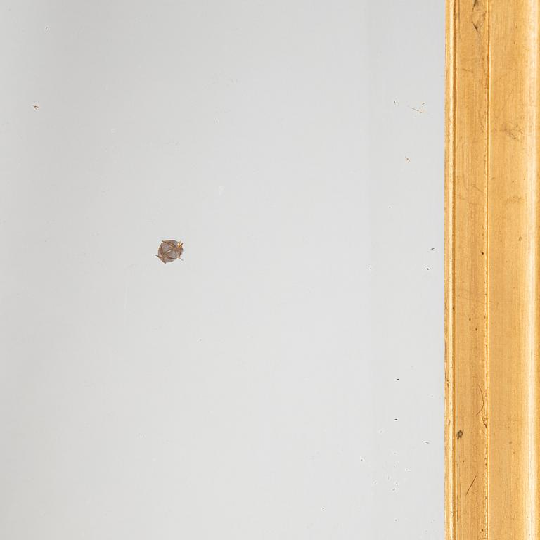 A mirror and console table from around the year 1900.