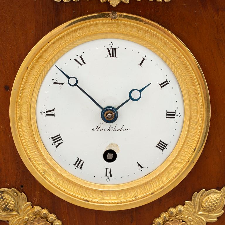An Empire mantel clock, early 19th Century.