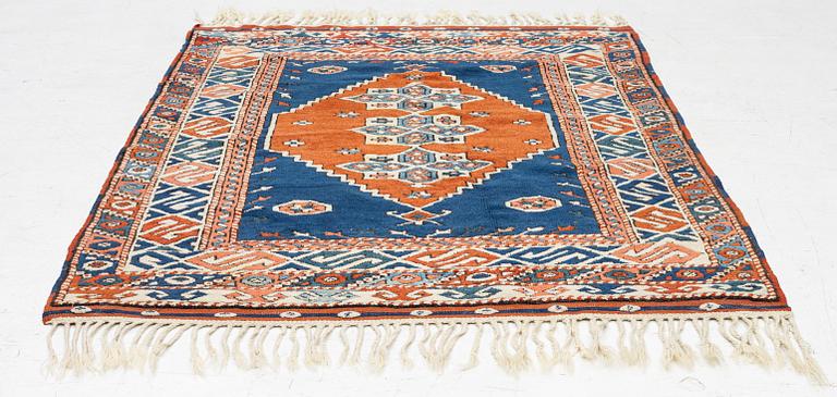 A semi-antique Turkish rug, 175 x 123 cm.