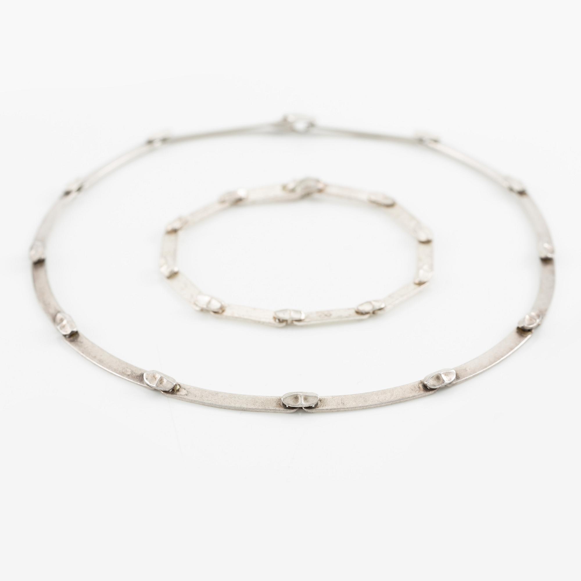 Lapponia a necklace, a pair of earrings and a brooch, sterling silver.