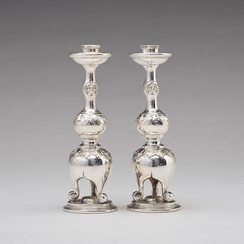 A pair of Chinese silver candle sticks, Shanghai, early 20th Century.