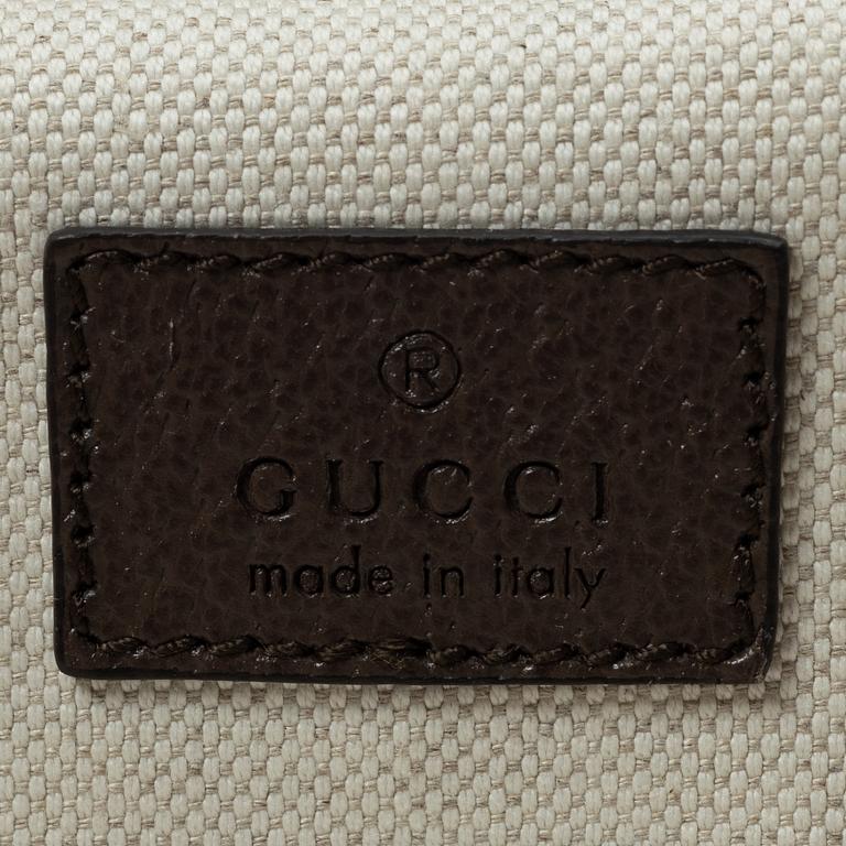 Gucci, suitcase / cabin bag.