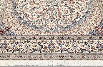 A Nain carpet, part silk, so-called 6LAA, c. 298 x 195 cm.