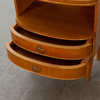 A pair of bedside tables from the mid 20th century.
