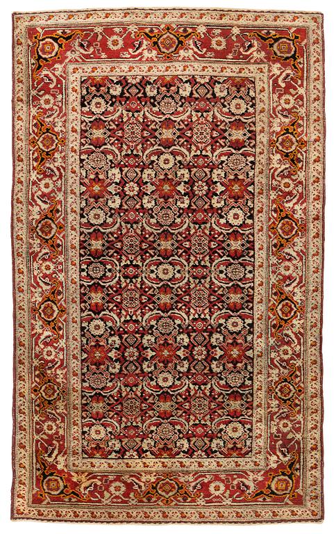 An antique Agra rug, ca 208 x 127 cm.