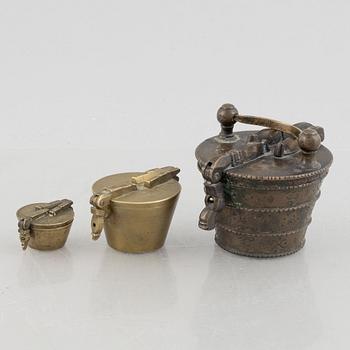 A set of three Nuremberg brass nested cup weights, one by Christoph or Johan Conrad Schön (masters 1746(1750).