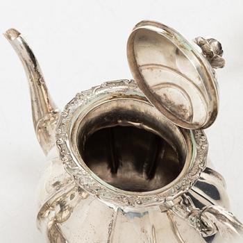 A Rococo style silver coffee pot, cream jug and sugar bowl, 20th century, Swedish import mark.