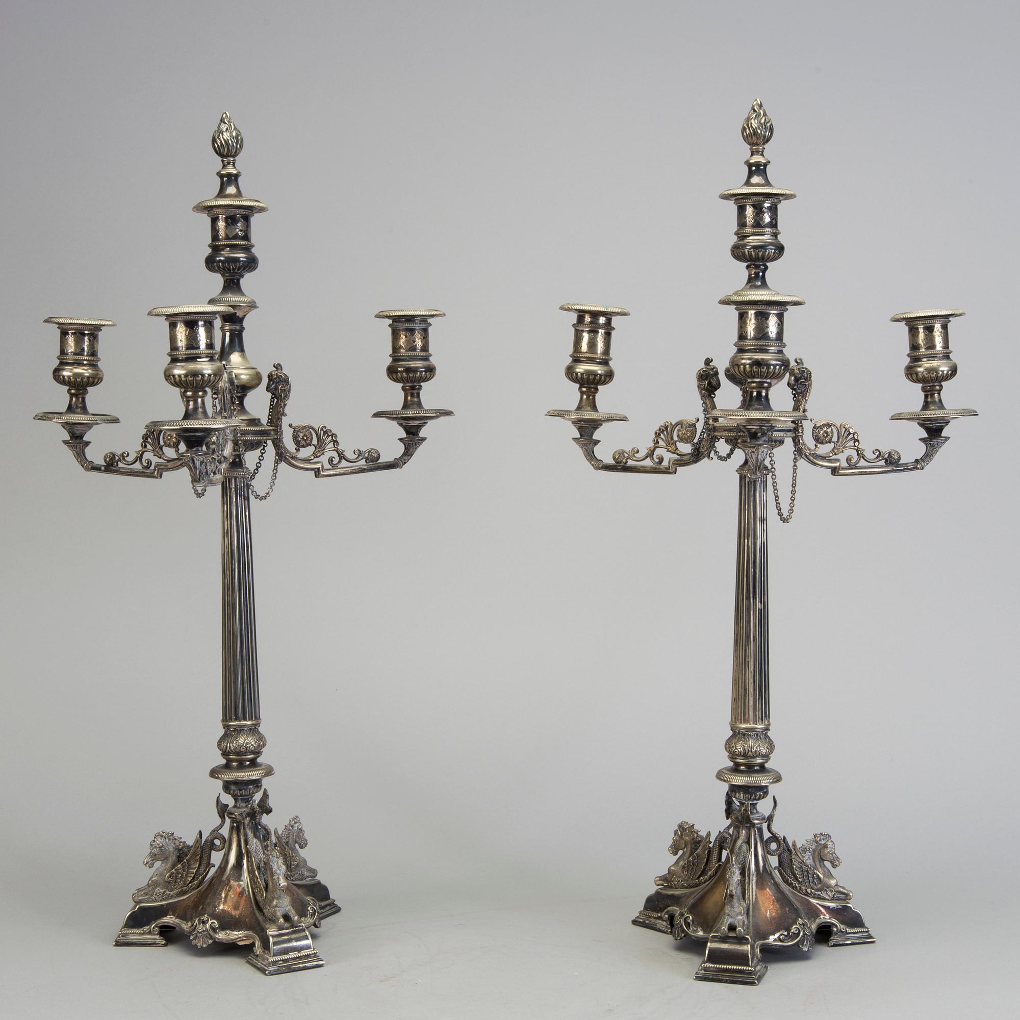 A pair of late 19th century silver plated kandelabras by Henry Wilkinson & Co Ltd, Sheffield, England.