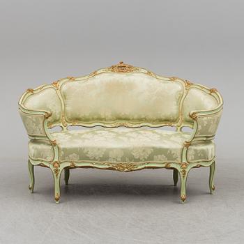 The second half of the 19th century Louis XV-style sofa.