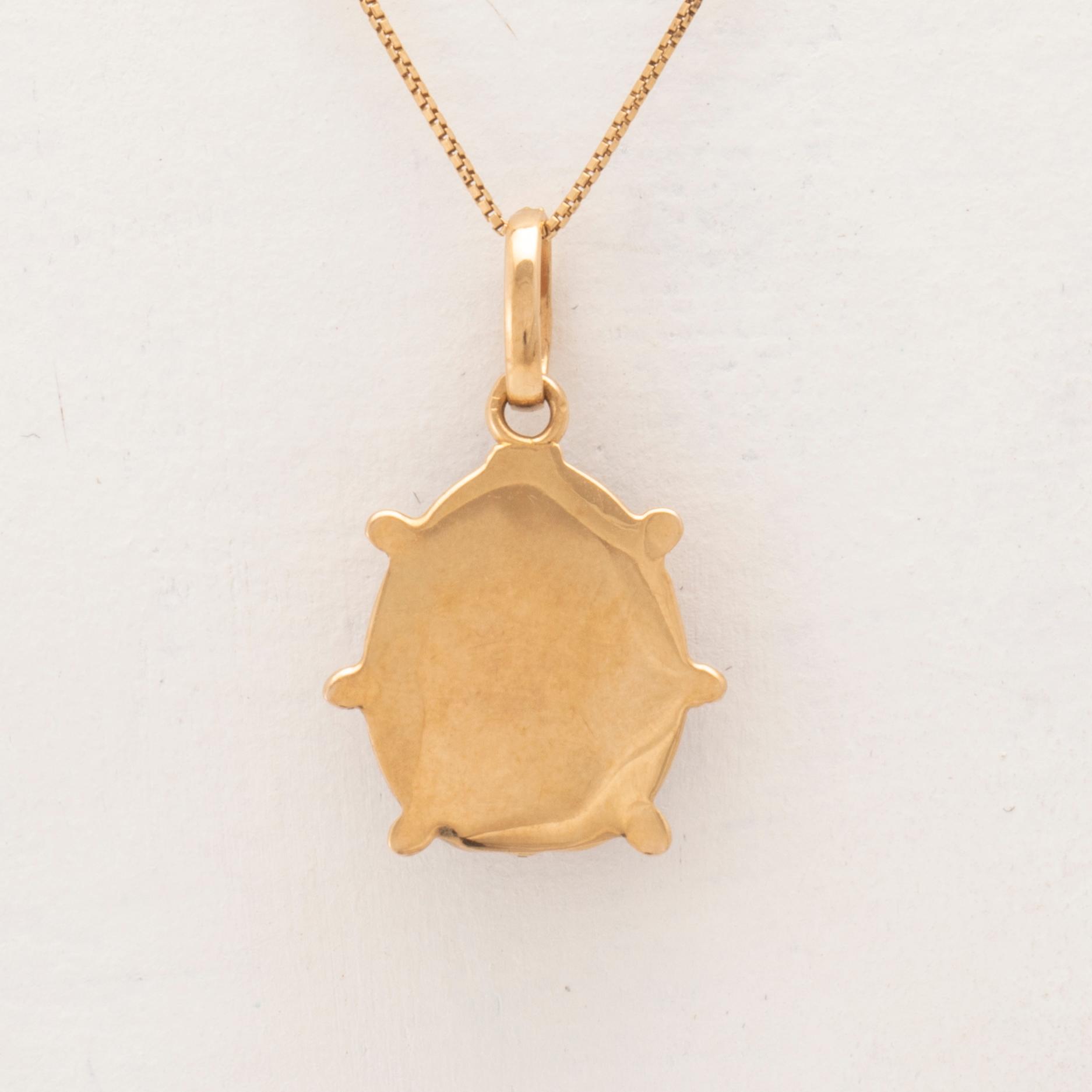 An 18K gold and enamel necklace.