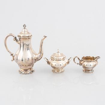A silver coffee pot, cream jug and sugar bowl, Swedish import marks Torndahl-Ekström, Stockholm 1921.