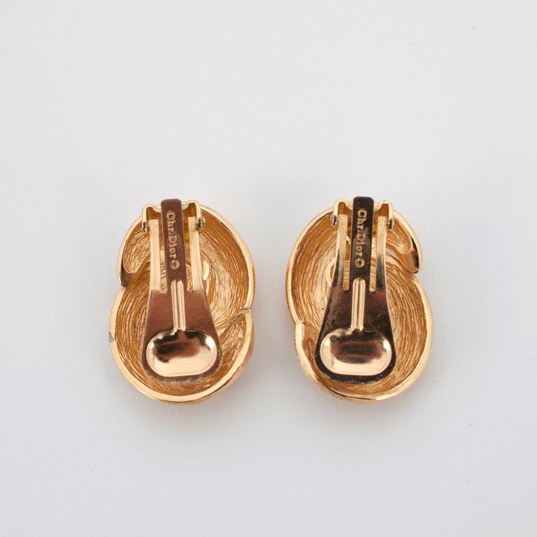 CHRISTIAN DIOR, a pair of gold metal clip erarings.