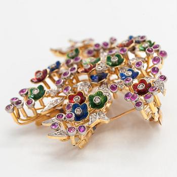 A 17K gold brooch/pendant with rose-cut diamonds, cabochon-cut rubies and enamel.