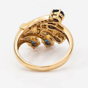 An 18K gold ring with diamonds ca. 0.07 ct in total and sapphires.