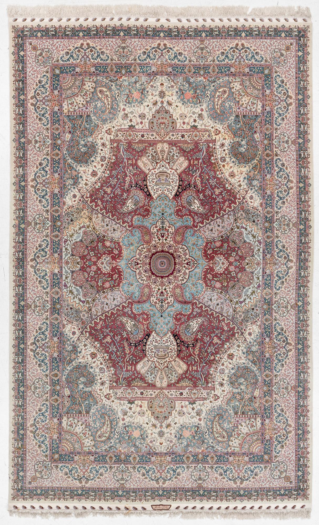 A Tabriz, carpet, 310 x 195 cm. signed.