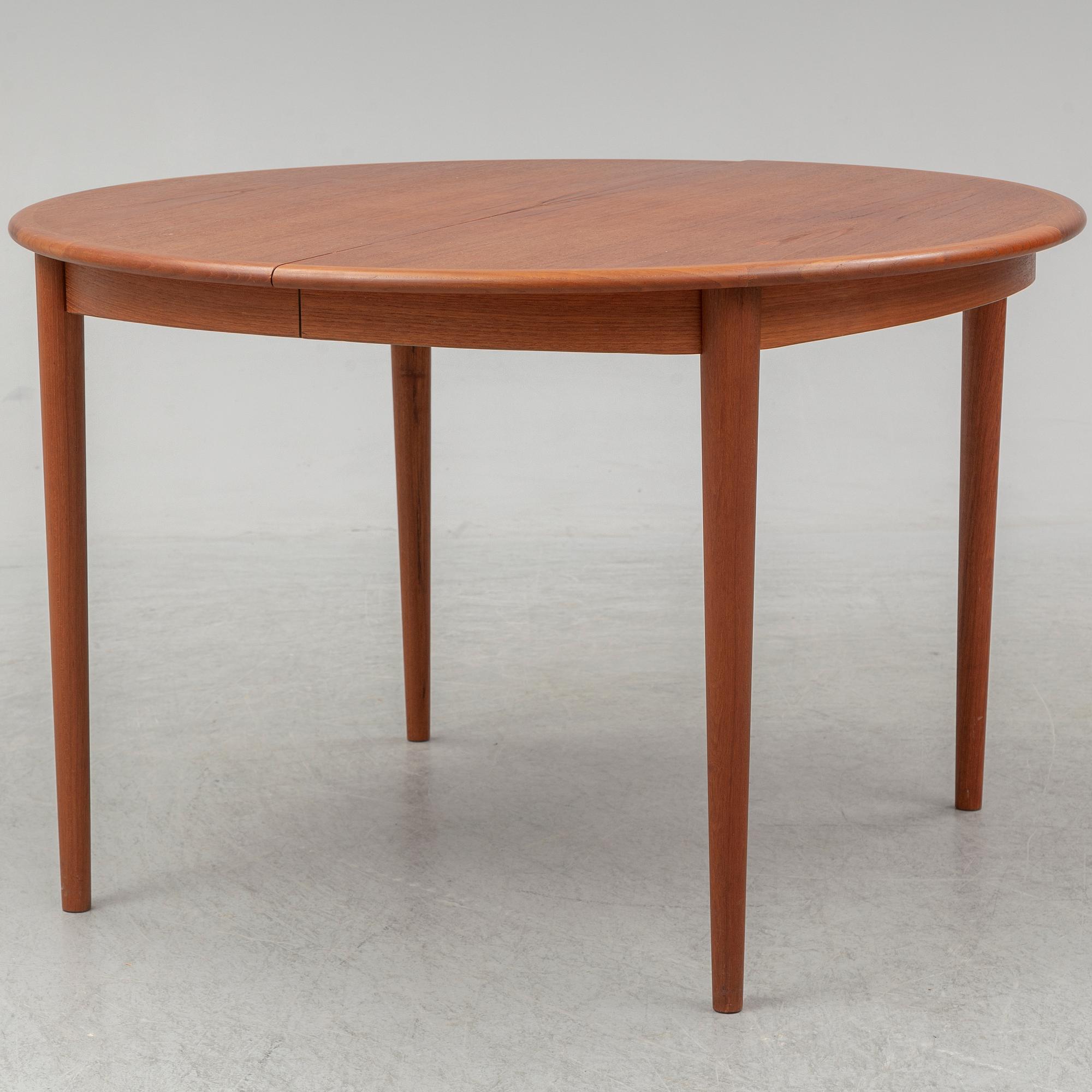 A 1960s teak veneered dining table.