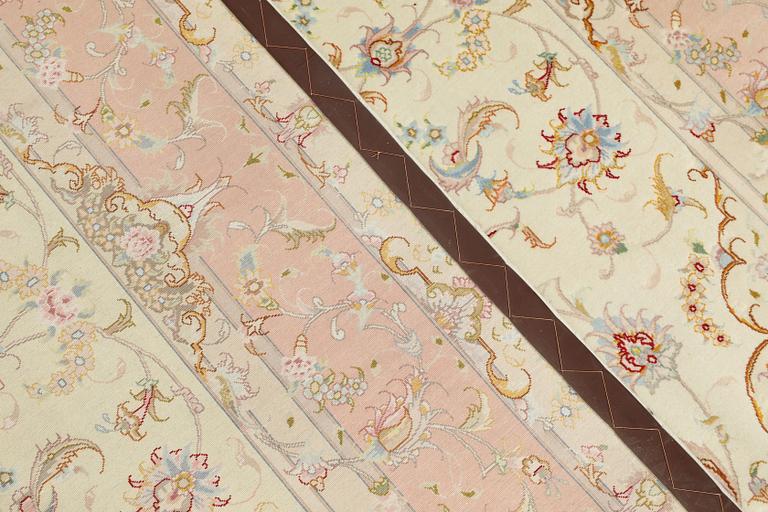 A Tabriz part silk carpet, signed, 305 x 203 cm.