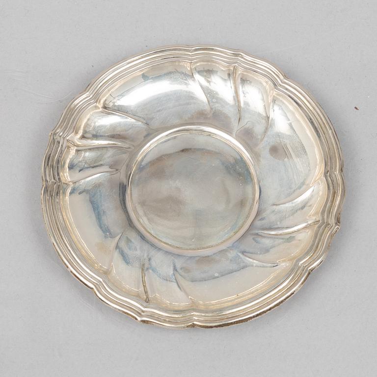 A set of eleven silver cups with saucers and a bowl, Germany, 20th Century.
