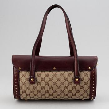Gucci, a monogram canvas bag.