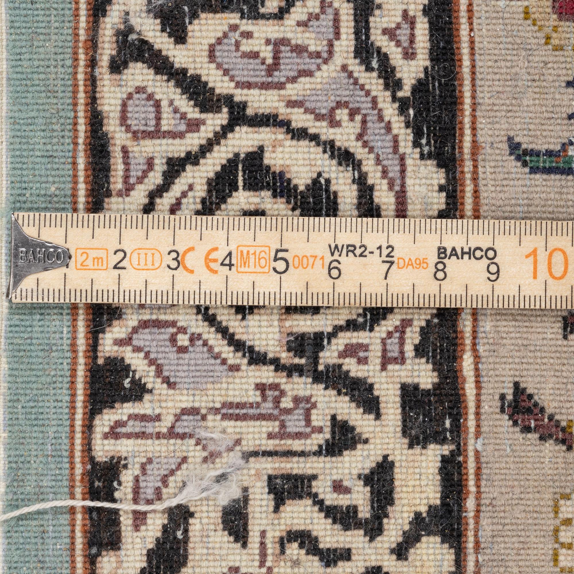 A signed pictoral Isfahan rug, Central Persia (Iran), signed, c. 235 x 154 cm.