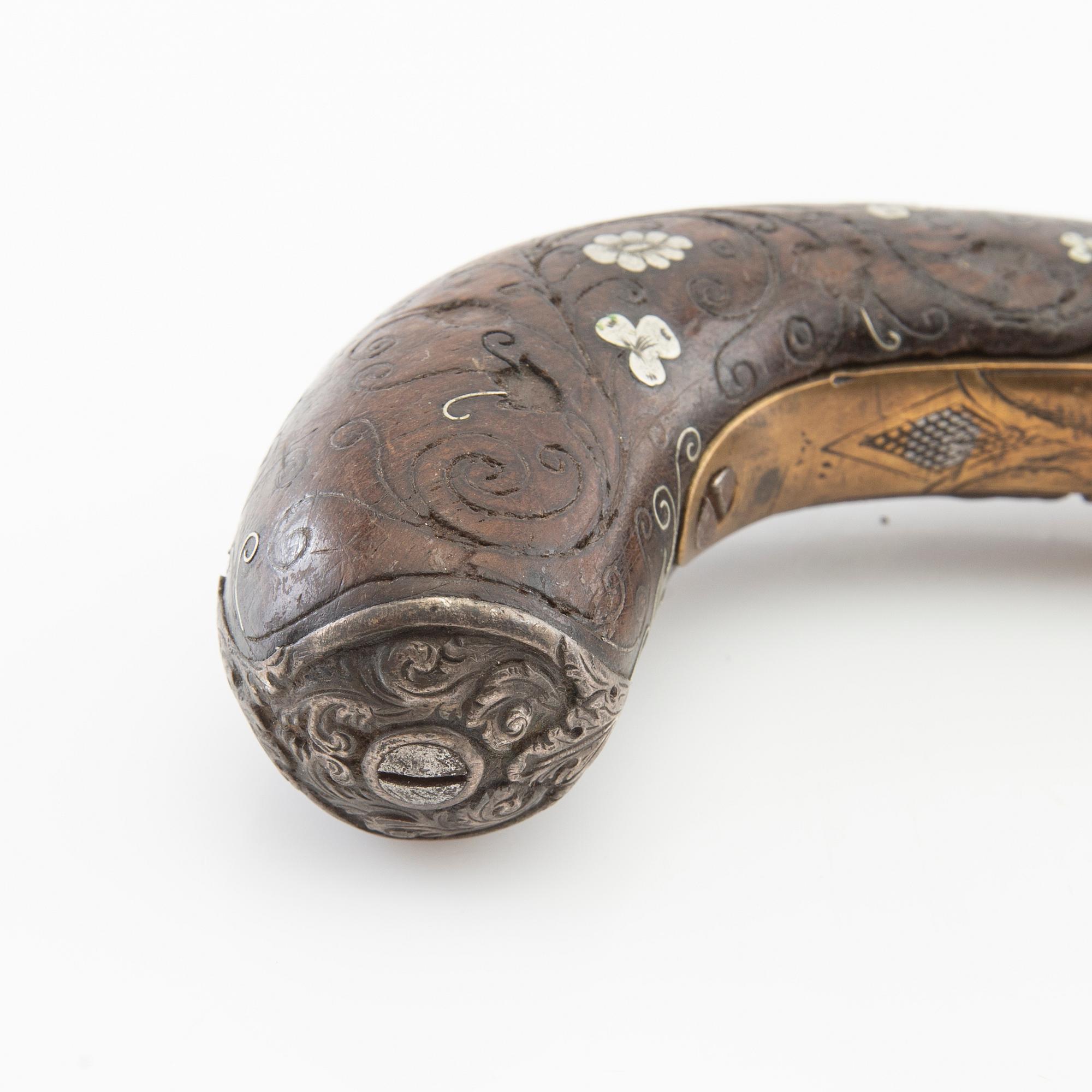 A British percussion pistol, 19th century.