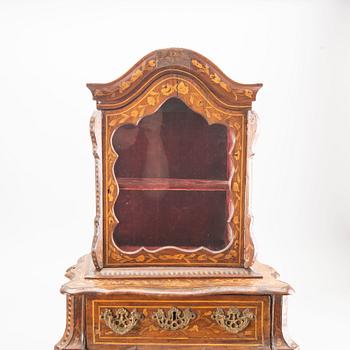 A Louis XV-style miniature cabinet around 1900.