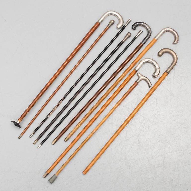 NINE WALKING STICKS, silver handles and a stick with plate handle, first half of the 20th century.