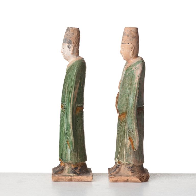 Two green and yellow glazed pottery figures of Ming officials, Ming style, 20th Century.