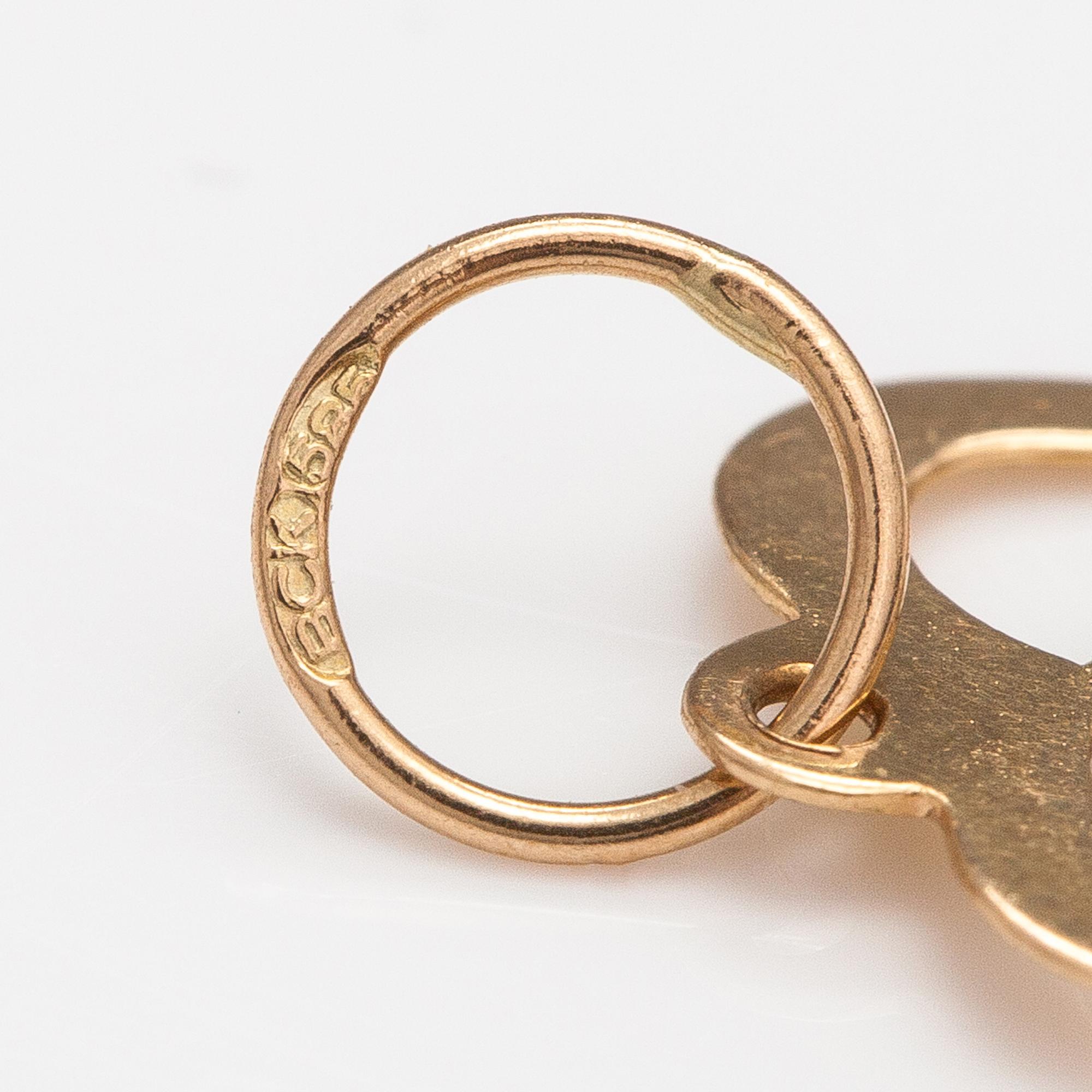 Two 14K gold pendants one with a diamond ca. 0.0025 ct.