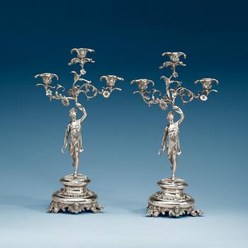 1021. A pair of Swedish 19th century silver candelabra, makers mark of Gustaf Möllenborg, Stockholm 1864.