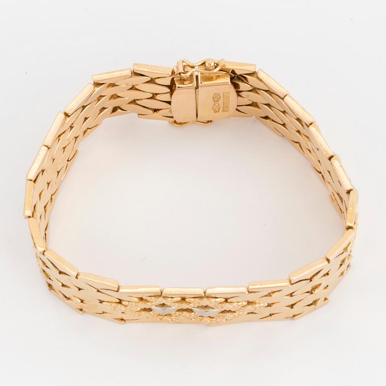 ARMBAND, guld och vitguld 18K, 16 mm brett platt, 33 gram.