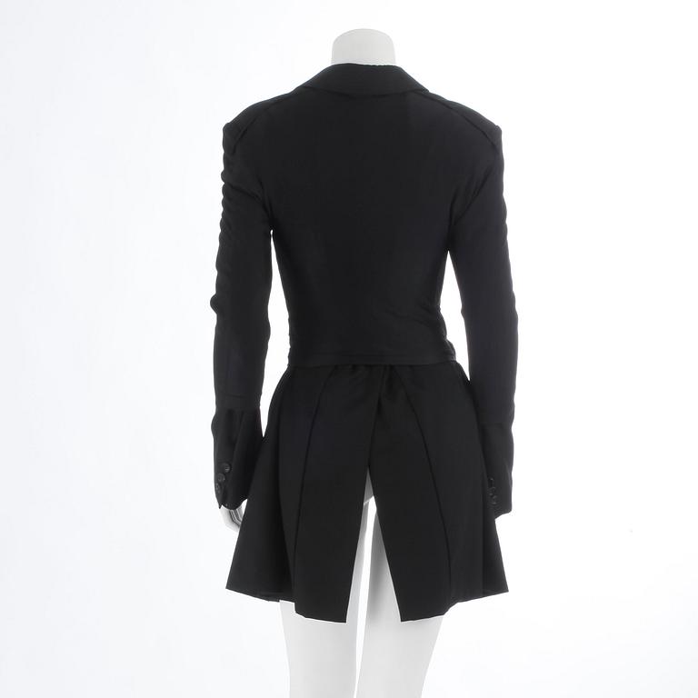 COMME DES GARÇONS, a black wool and lycra ladies suits jacket. Size m.