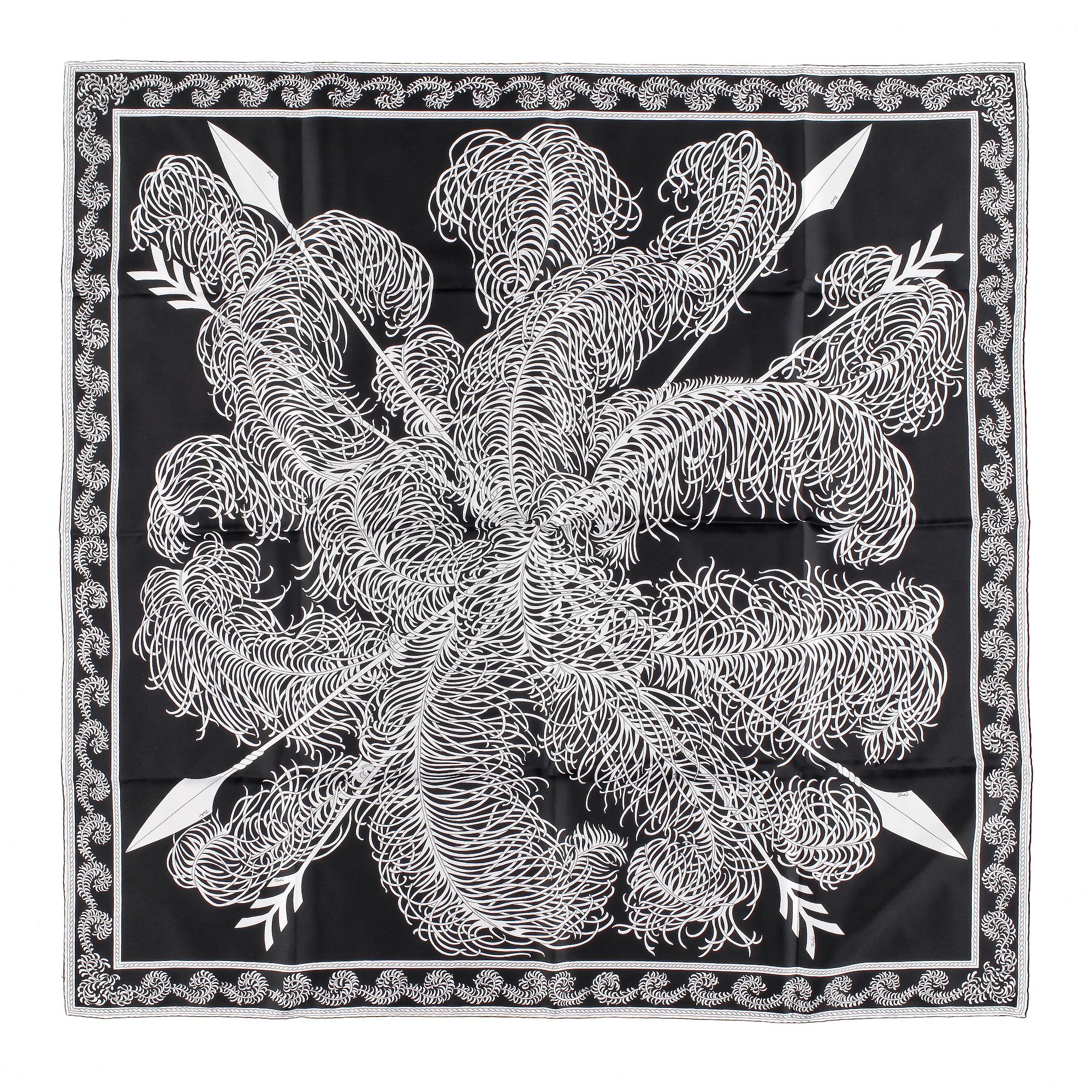 A set of three scarves by Christian Dior, Emilio Pucci and Yves Saint Laurent.