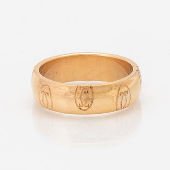 An 18K gold ring "Logo de Cartier" by Cartier.