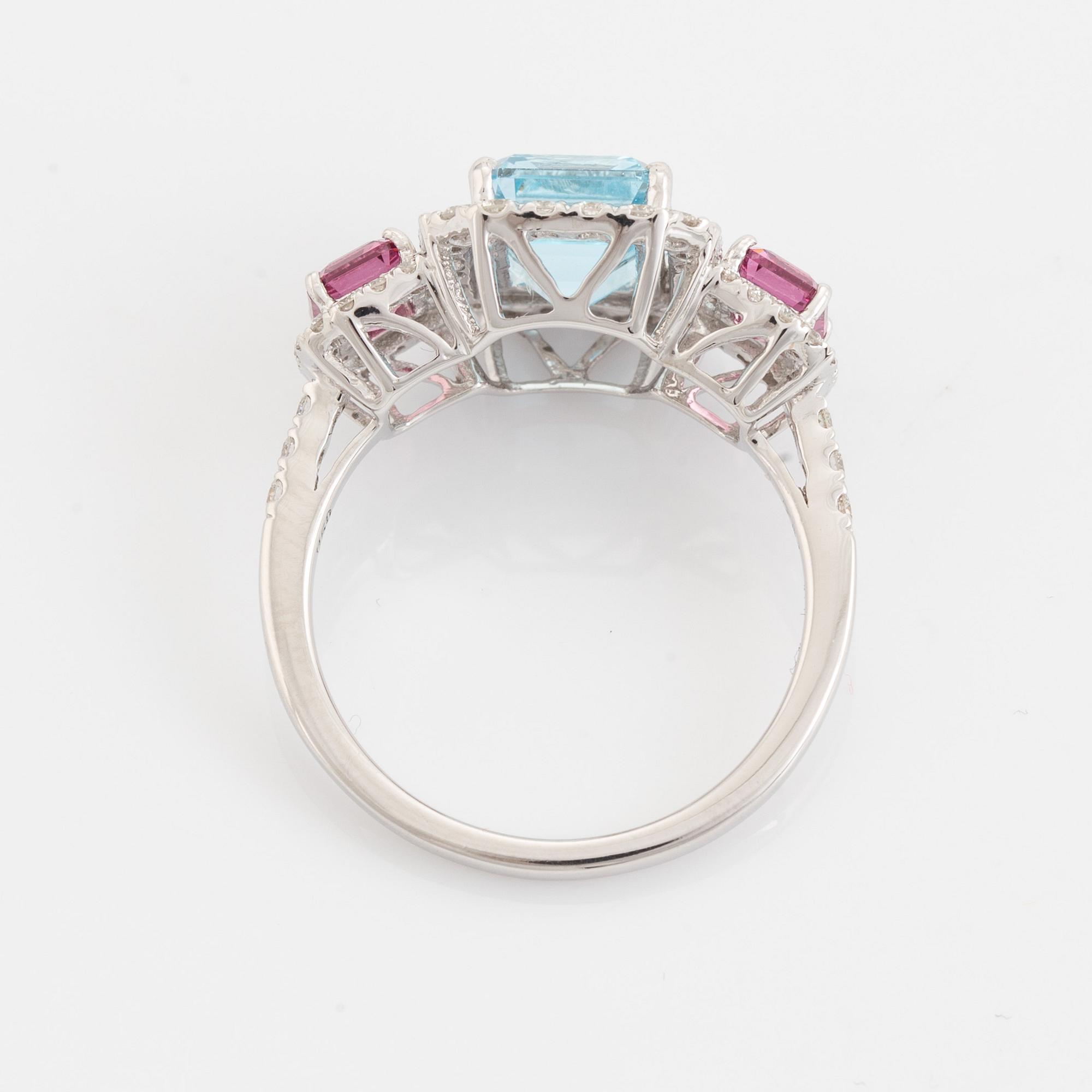 Ring, med blå topas, granat och briljantslipade diamanter.