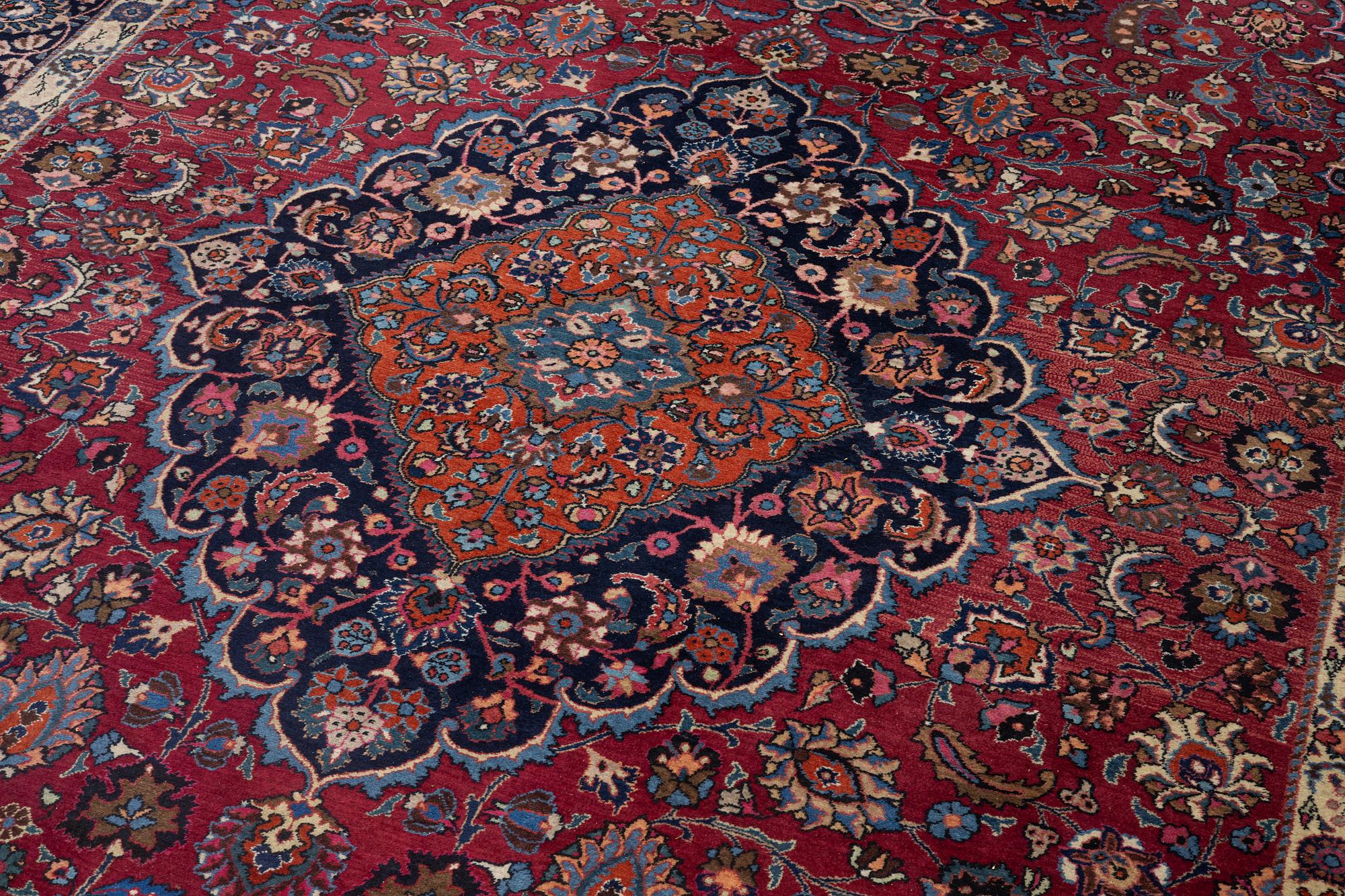 A semi-antique Mashad carpet, Eastern Iran, signed c. 507 x 303 cm.