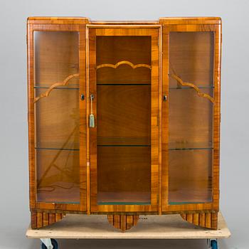 A 1940s display cabinet, England.