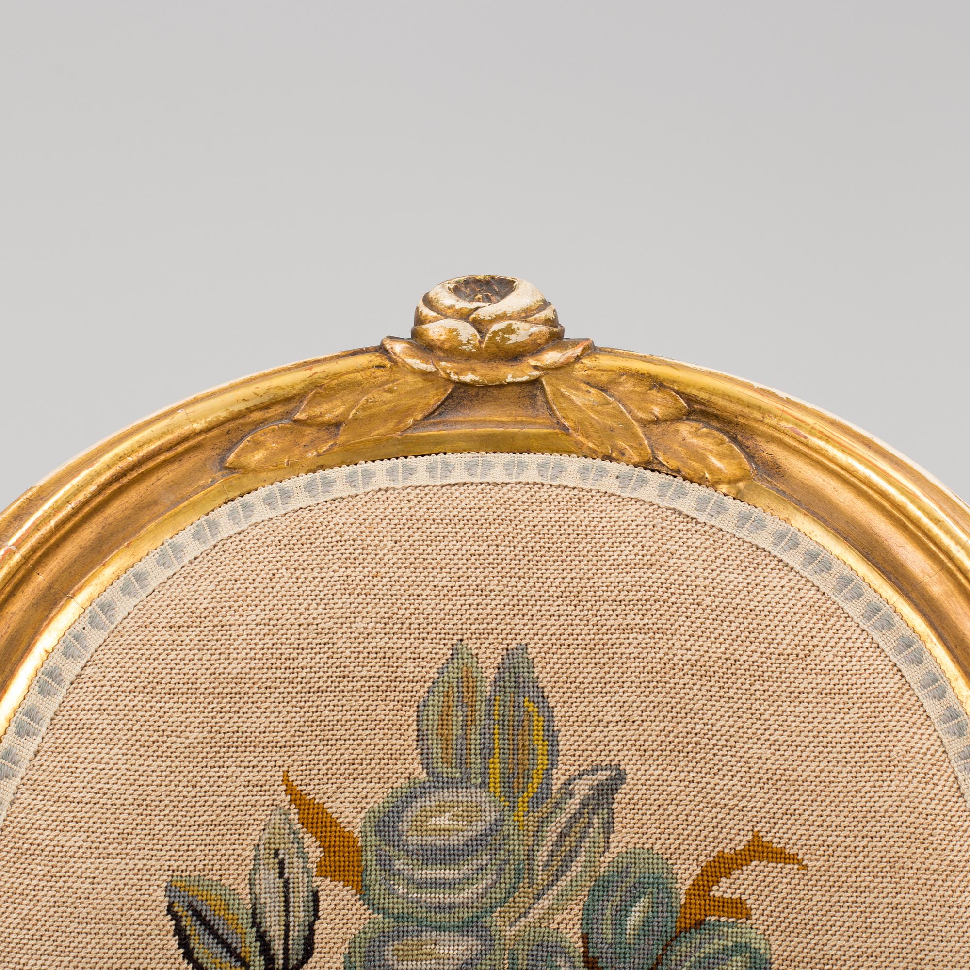 A Gustavian style arm chair, first half ot the 20th Century.