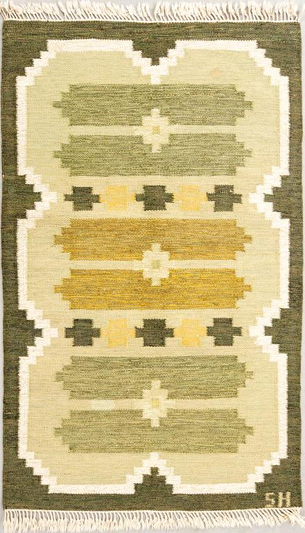 Flat-weave rug signed SH, approximately 194x133 cm.