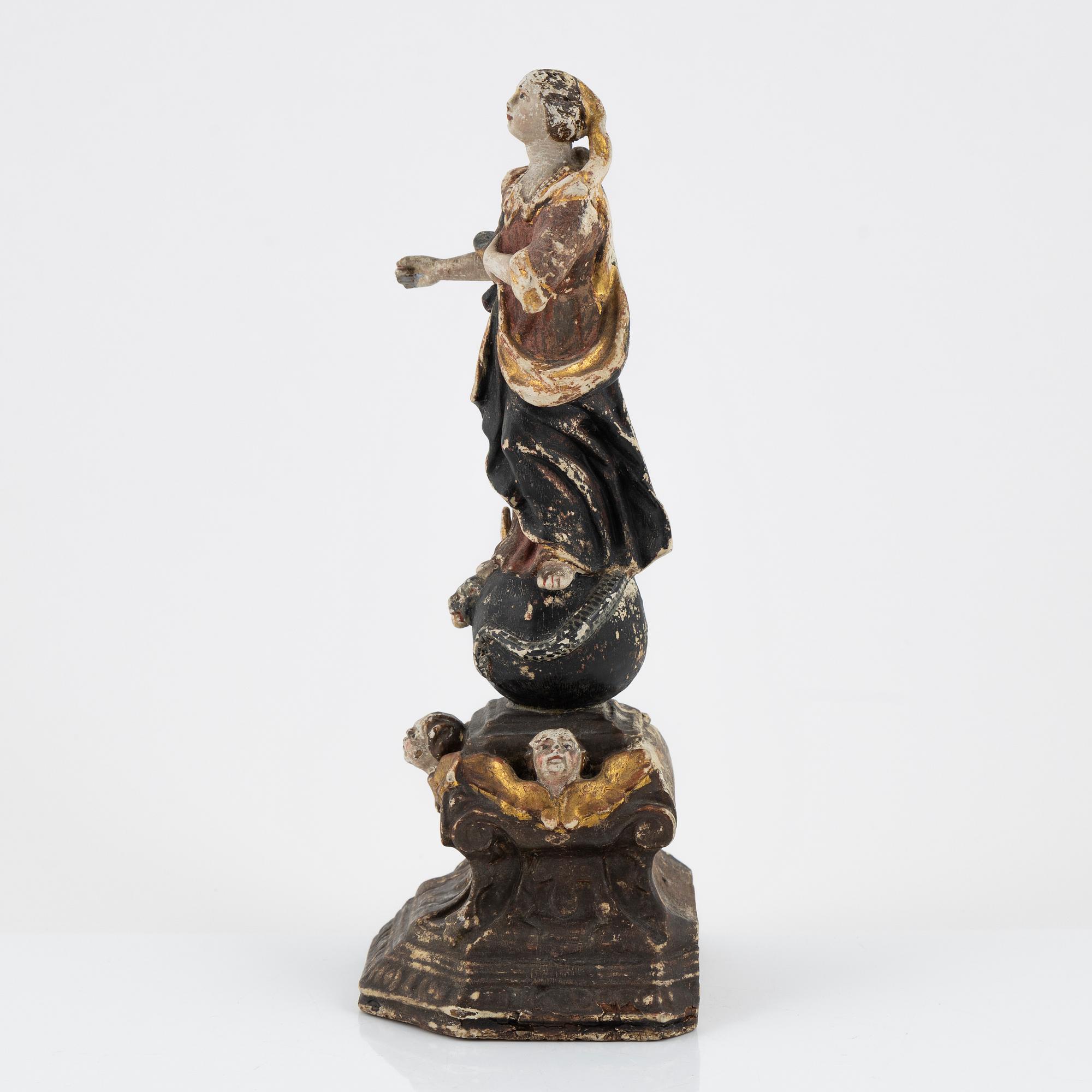 A carved and painted figure of the Virgin Mary crushing the Serpent, Southern Europe, 18th/19th century.