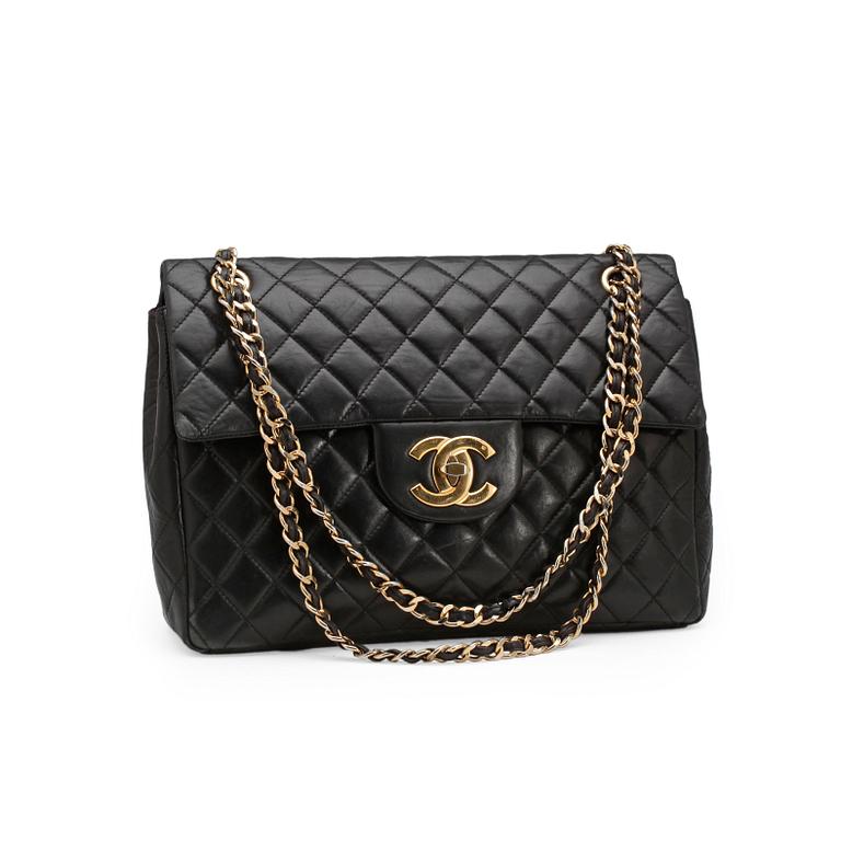 CHANEL, a quilted black leather shoulder bag, "Flap bag maxi".