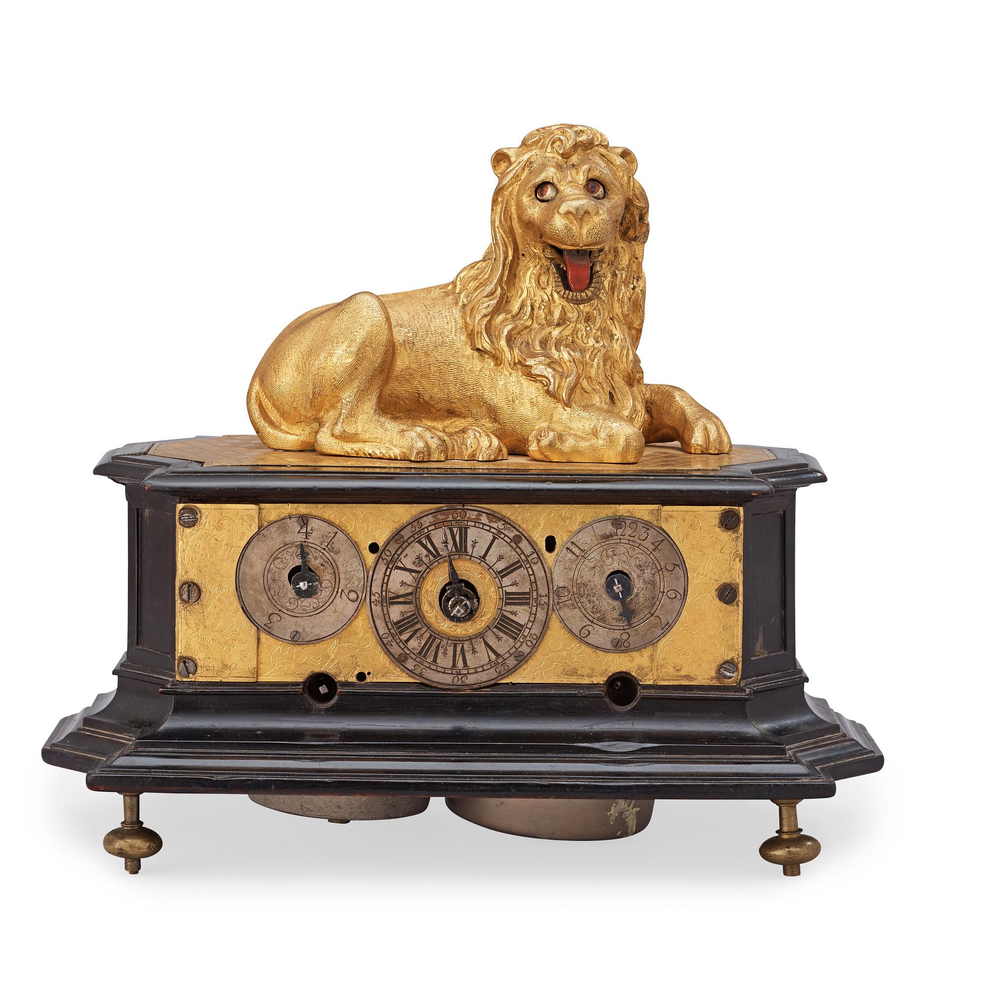 A rare gilt brass on ebonised base Lion Automaton figure clock, Augsburg circa 1630.